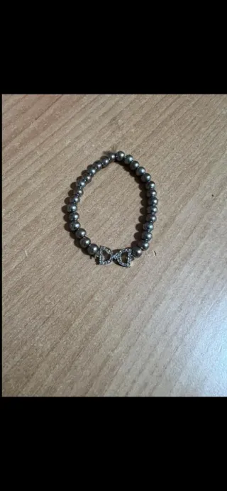 Bracciale perline con ciondolo doppio fiocco