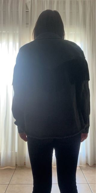 Tejana negra con flecos