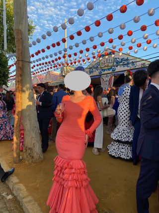 Traje de flamenca rosa con volantes