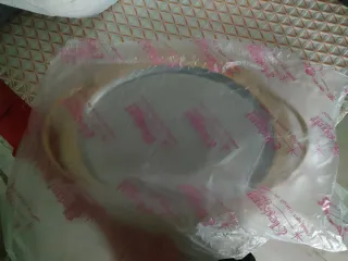 Vassoio ovale in acciaio inox con manici dorati