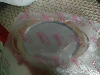 Vassoio ovale in acciaio inox con manici dorati