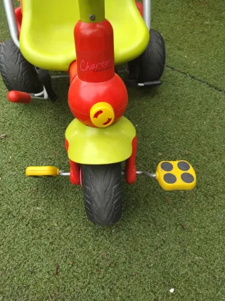 Triciclo infantil con bolsa naranja