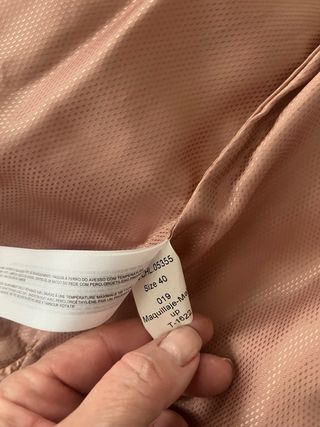 Chaleco plumífero con cuello de piel