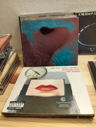 Lote de 20 CDs Rock: R.E.M., The Beatles, Emerson.