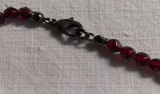 Collana con ciondolo viso di donna