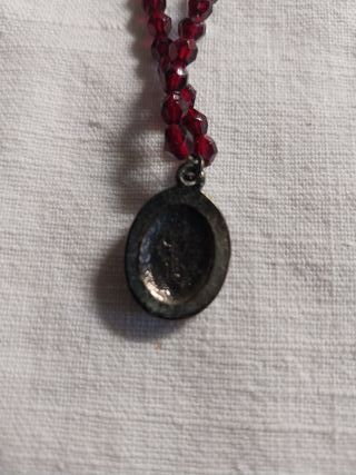 Collana con ciondolo viso di donna