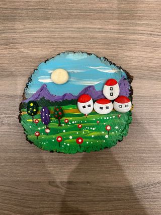 Decoración de madera con paisaje pintado