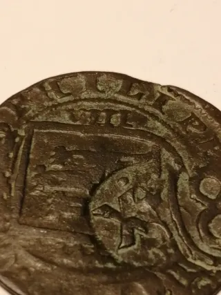 Moneda Felipe III resellada