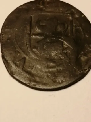 Moneda Felipe III resellada