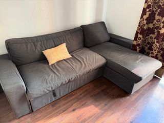 Sofá cama gris de tela