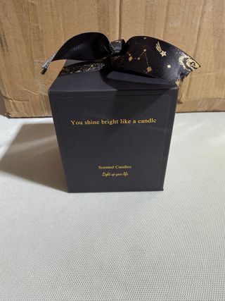 Vela aromática negra con lazo