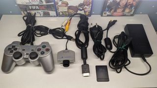 PS2 Slim Plateada Multiregion + Juegos + Eye Toy