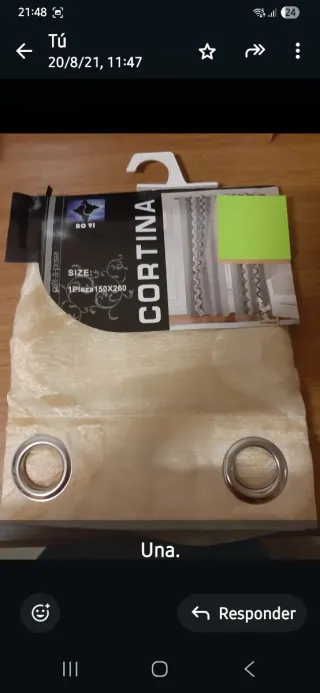 Cortina beige y ligera, nueva con su embalaje.