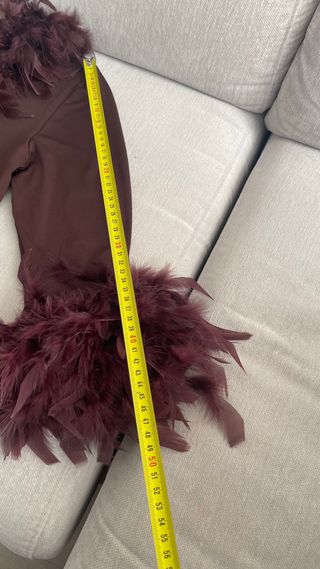 Blusa manga larga con plumas