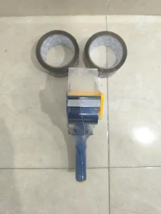 Pistola de embalaje y cinta adhesiva