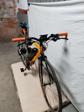 Bici eléctrica carretera Orbea naranja