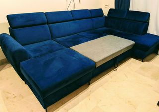 Sofá modular azul grande con cama