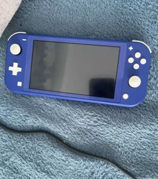 Nintendo Switch Lite Azul + Caja y Cargador.