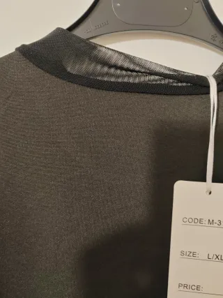 Body negro malla cuello alto manga larga