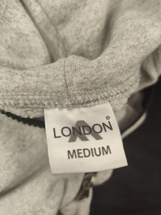 Sudadera gris con cremallera