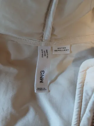 Chaleco plumífero largo con capucha