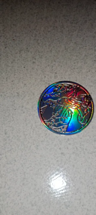 Moneda Mega Charizard X