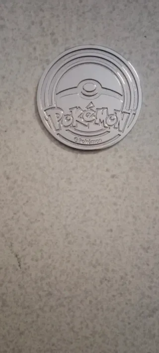 Moneda Mega Charizard X