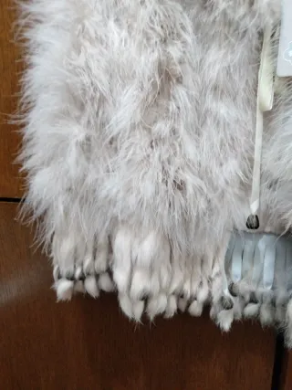 Chaleco piel y plumas rosa palo sin usar