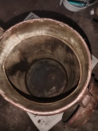 Lechera antigua de metal