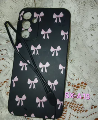 Funda móvil negra con lazos rosas