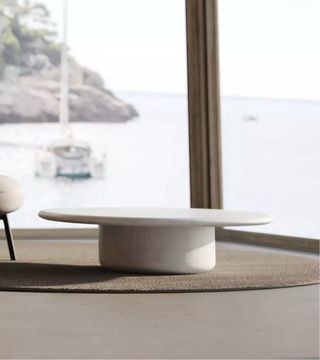 Mesa de centro USOO redonda blanca roto.