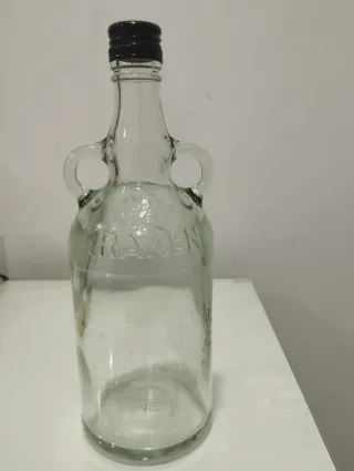 Garrafa de vidro antiga com pegas