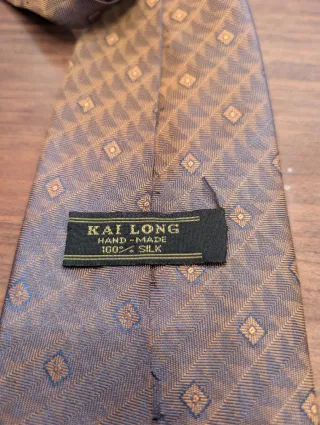 Corbata de seda naranja y dorada