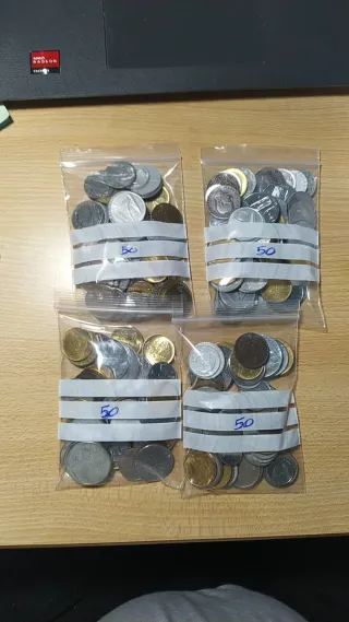 Lotto di 4 sacchetti monete