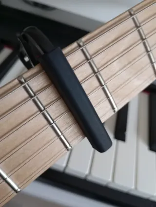 Capo, cejilla adaptable para guitarra