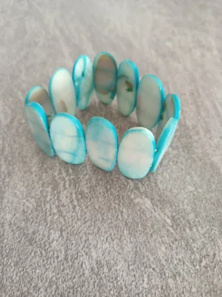 Dos pulseras óvalo azul y amarillo