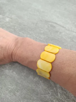 Dos pulseras óvalo azul y amarillo