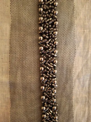 Pasamanería pedrería negra y plateada