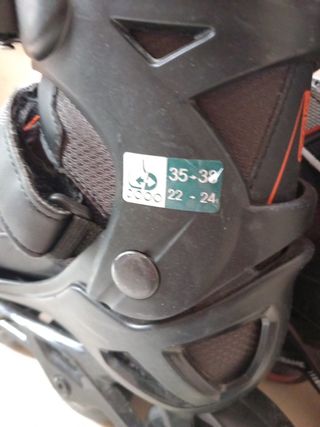 Pattini in linea neri e arancioni Oxelo