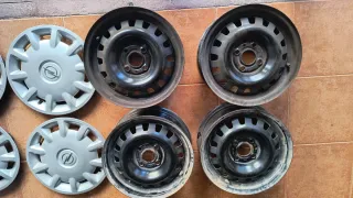 Llantas Opel Astra 14 con tapacubos originales