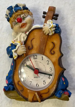 Orologio clown con violino