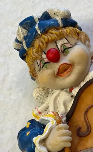 Orologio clown con violino