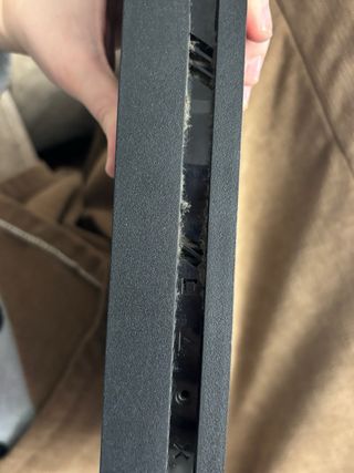 PS4 Negra con mando y auriculares