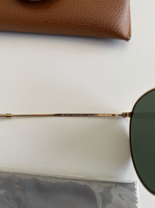 Gafas de sol Ray-Ban doradas y marrones