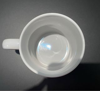 Tazza magica arancione e bianca