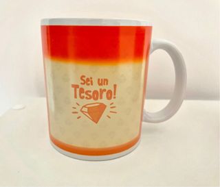 Tazza magica arancione e bianca