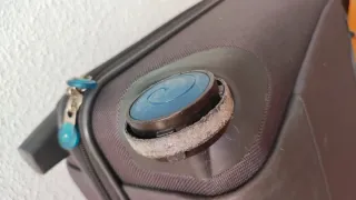 Maleta de cabina gris y turquesa, a reparar