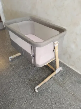 cuna con laterales de malla