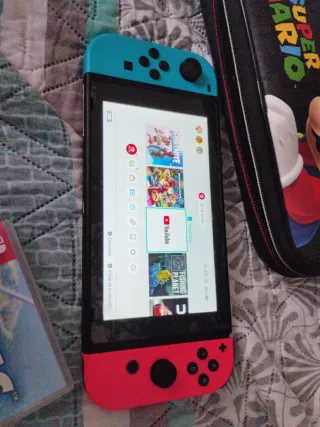 Nintendo Switch Azul con 2 juegos y estuche