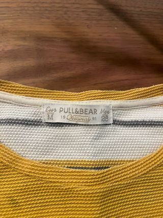 Camiseta de rayas amarillas y grises